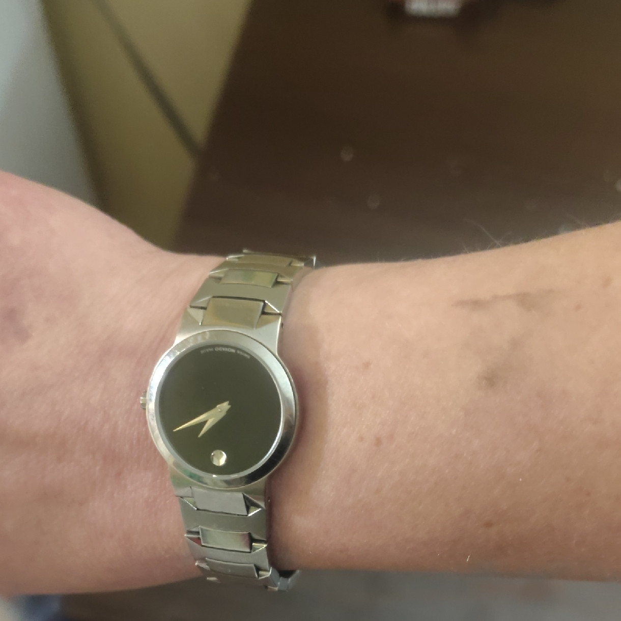 Movado Womens Watch With Silver Bracelet And Black Dial